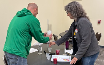Two teachers working together during a science training workshop