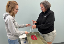Two teachers working with water tables