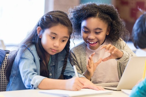 Two excited students discussing their experiment